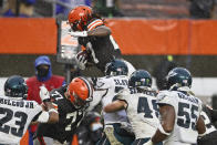 Cleveland Browns running back Kareem Hunt, top, rushes for a 5-yard touchdown during the second half of an NFL football game against the Philadelphia Eagles, Sunday, Nov. 22, 2020, in Cleveland. (AP Photo/Ron Schwane)