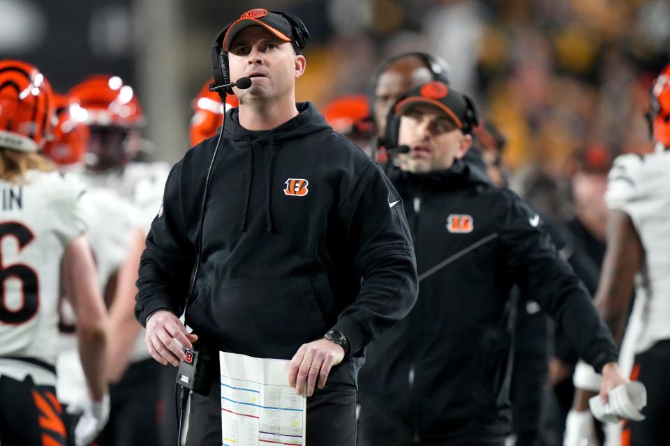 Cincinnati Bengals head coach Zac Taylor watches a replay of a play in the end zone in the second quarter during a Week 16 NFL football game between the Cincinnati Bengals and the Pittsburgh Steelersl, Saturday, Dec. 23, 2023, at Acrisure Stadium in Pittsburgh, Pa.