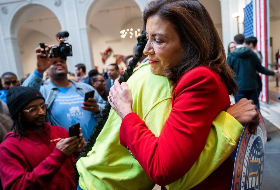 Gov. Kathy Hochul embraces a supporter after signing the Clean Slate Act at the Brooklyn Museum on Nov. 16, 2023