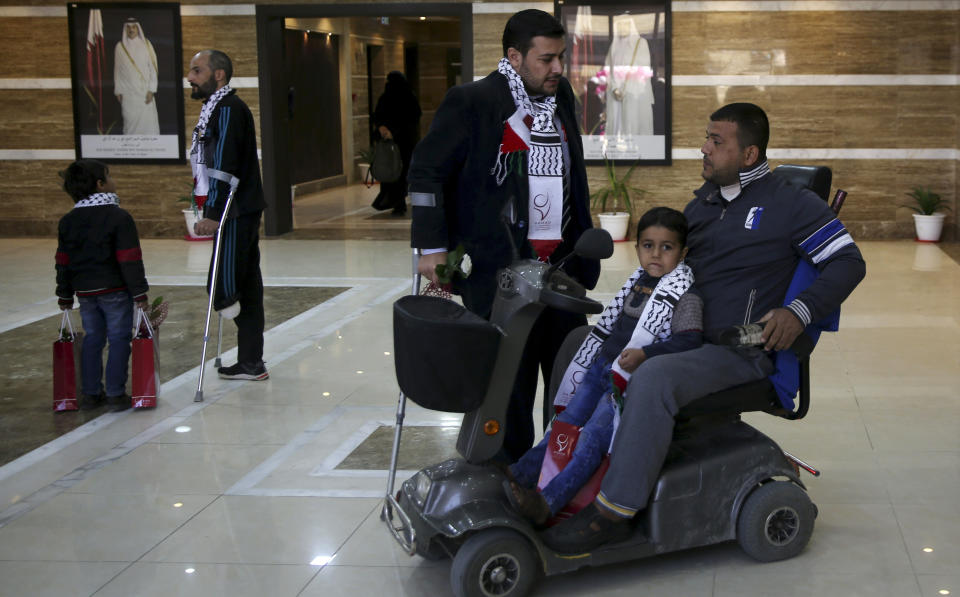 Palestinian patients wait at the new Sheikh Hamad bin Khalifa Al Thani Hospital for Rehabilitation and Artificial limbs in Gaza City, Monday, April 22, 2019. Qatar inaugurated the Gaza Strip's first prosthetic hospital and disability rehab center after many delays. Health officials say the 100-bed hospital is vital for Gaza, where more than 130 Palestinians have lost limbs over the past year during ongoing protests along Gaza-Israel perimeter fence. (AP Photo/Adel Hana)