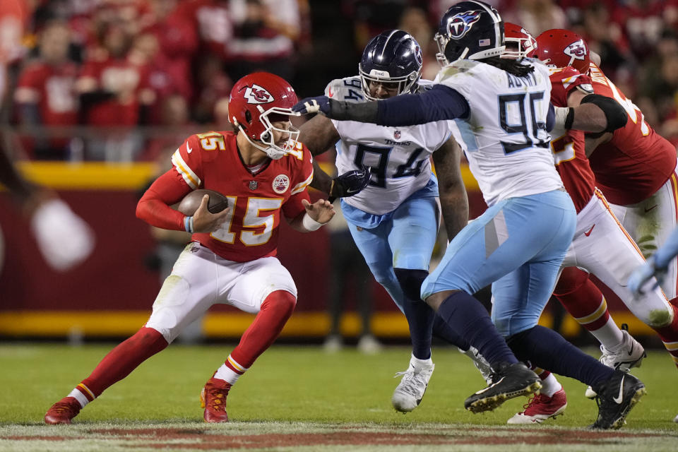 Kansas City Chiefs quarterback Patrick Mahomes (15) is sacked by Tennessee Titans defensive end Mario Edwards Jr. (94) as defensive end Denico Autry (96) defends during the second half of an NFL football game Sunday, Nov. 6, 2022, in Kansas City, Mo. (AP Photo/Charlie Riedel)