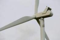 This Monday, June 13, 2022 photo shows a wind turbine at a wind farm along the Montana-Wyoming state line. The rush to build wind farms to combat climate change is colliding with preservation of one of the U.S. West's most spectacular predators, the golden eagle. Scientists say the species is teetering on the edge of decline and worry that proliferating wind turbines could push them over the brink. (AP Photo/Emma H. Tobin)