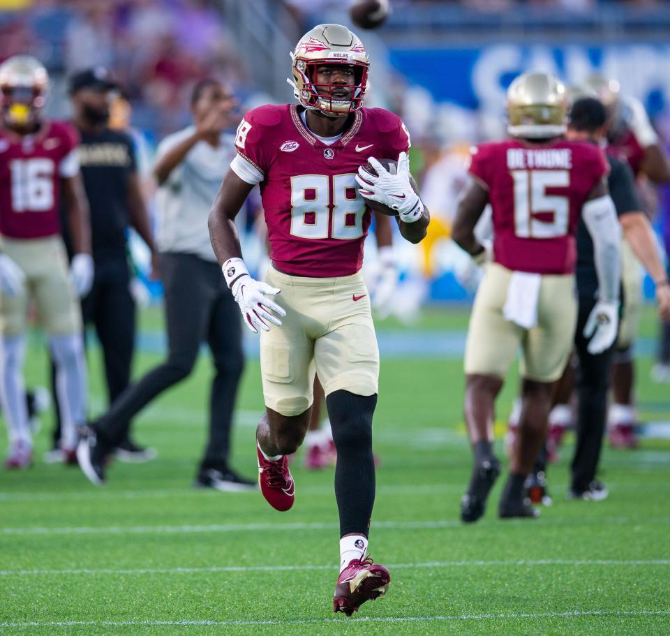 Florida State Seminoles wide receiver Kentron Poitier (88) warms up before kickoff at Camping World Stadium on Sunday, Sept. 3, 2023.