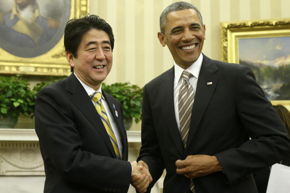 President Barack Obama shakes hands with Japan's Prime Minister Shinzo Abe in the Oval Office of the White House in Washington, Friday, Feb. 22, 2013.