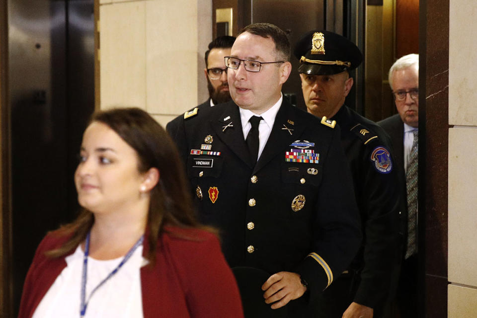 Army Lieutenant Colonel Alexander Vindman, a military officer at the National Security Council, center, arrives on Capitol Hill in Washington, Tuesday, Oct. 29, 2019, to appear before a House Committee on Foreign Affairs, Permanent Select Committee on Intelligence, and Committee on Oversight and Reform joint interview with the transcript to be part of the impeachment inquiry into President Donald Trump.(AP Photo/Patrick Semansky)