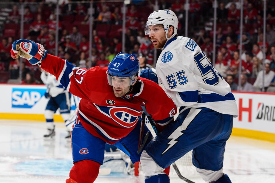 MONTREAL, QC - MAY 09:  Max Pacioretty #67 of the Montreal Canadiens gets tangled up with Braydon Coburn #55 of the Tampa Bay Lightning in Game Five of the Eastern Conference Semifinals during the 2015 NHL Stanley Cup Playoffs at the Bell Centre on May 9, 2015 in Montreal, Quebec, Canada. (Photo by Minas Panagiotakis/Getty Images)