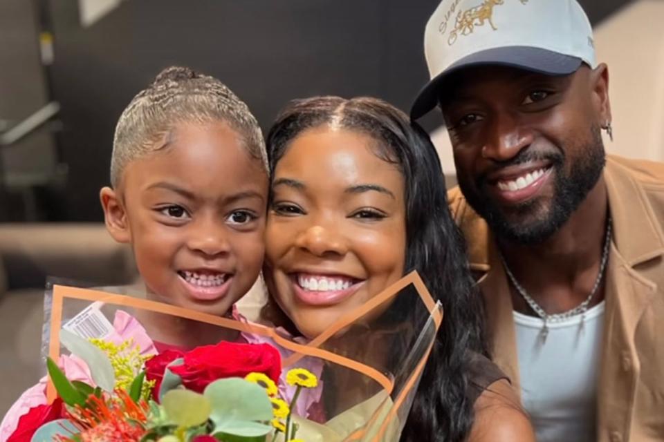 <p>Gabrielle Union-Wade/Instagram</p> Gabrielle Union (middle) and husband Dwyane Wade with their daughter Kaavia, 4, after her dance recital.