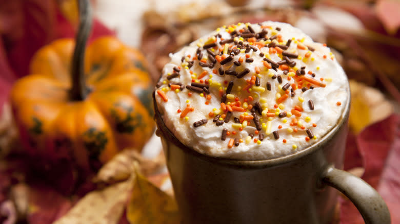 pumpkin spice latte with whipped cream and sprinkles