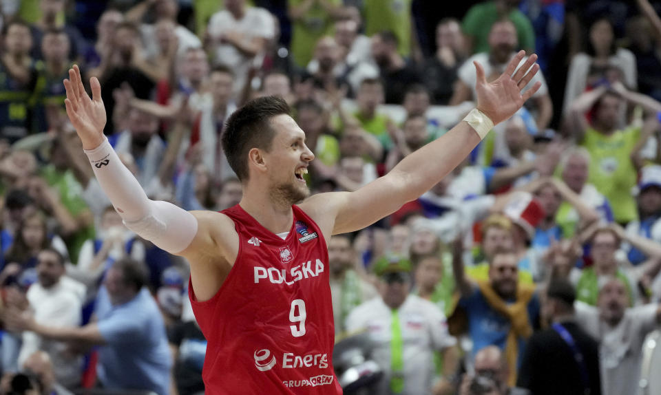 Poland's Mateusz Ponitka celebrates after the Eurobasket quarter final basketball match between Slovenia and Poland in Berlin, Germany, Wednesday, Sept. 14, 2022. Poland defeated Slovenia by 90-87. (AP Photo/Michael Sohn)