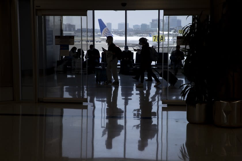 Los Angeles, CA - May 28: Amid a busy getaway travel day for the Memorial Day weekend and the first holiday since coronavirus pandemic restrictions have been relaxed, travelers make their way to their destinations at LAX, United Airlines, Terminal 7 in Los Angeles Friday, May 28, 2021. Officials say travelers should arrive early for Memorial Day weekend flights. After months of Los Angeles International Airport looking like a ghost town, holiday crowds are back. "We're seeing more travelers than we've seen in the last 14 months. We had over 75,000 people come through on Sunday alone to the TSA checkpoints, that's by far a record in 2021 for us," said LAX spokesperson Keith Montgomery. Photo taken in LAX on Friday, May 28, 2021 in Los Angeles, CA. (Allen J. Schaben / Los Angeles Times)