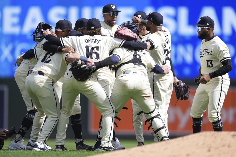 Minnesota Twins players celebrate after the 3-2 win in a baseball game against the Los Angeles Dodgers, Wednesday, April 10, 2024, in Minneapolis. (AP Photo/Abbie Parr)