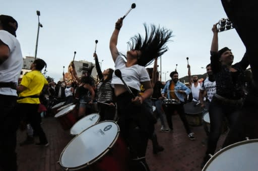 Hundreds of people, some playing musical instruments and others banging pots and pans, demonstrated on Thursday in the north of the capital Bogota