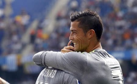 Real Madrid's Cristiano Ronaldo (R) celebrates a goal against Espanyol during their Spanish first division soccer match in Cornella de Llobregat, near Barcelona, Spain, September 12, 2015. REUTERS/Albert Gea