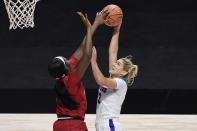 Louisville's Elizabeth Dixon, left, stops a shot-attempt by DePaul's Dee Bekelja in the first half of an NCAA college basketball game, Friday, Dec. 4, 2020, in Uncasville, Conn. (AP Photo/Jessica Hill)