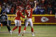 Kansas City Chiefs kicker Harrison Butker (7) celebrates with teammate Tommy Townsend (5) after kicking a 49-yard field goal during the fourth quarter of an NFL divisional round playoff football game against the Buffalo Bills, Sunday, Jan. 23, 2022, in Kansas City, Mo. The Chiefs won 42-36. (AP Photo/Colin E. Braley)