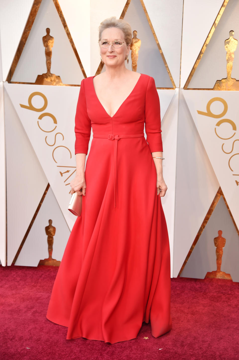 <p>Meryl Streep’s red Dior gown was pretty simple — but was a stand out thanks to the color and the plunging neckline. (Photo by Kevin Mazur/WireImage) </p>