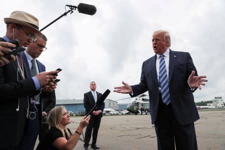 FILE PHOTO: U.S. President Trump talks to reporters as he boards Air Force One for travel to Pennsylvania from Morristown Municipal Airport in Morristown, New Jersey