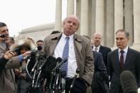 Michael Carvin, one of the attorneys against the U.S. government in the King v. Burwell case, speaks to reporters after arguments at the Supreme Court building in Washington, March 4, 2015. Also pictured is Attorney General of Oklahoma Scott Pruitt (R). REUTERS/Jonathan Ernst