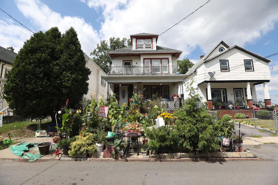 Reggie Garner's home on Rodney Street in Buffalo, NY, Saturday, July 30, 2022, is filled with plants that he grew.