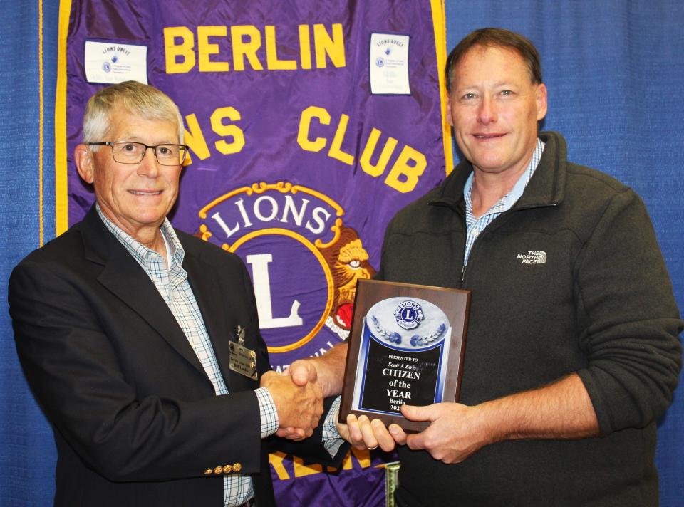 Bill Landis (left), vice president of the Berlin Lions Club, presents Scott Etris of Berlin with the 35th annual Outstanding Citizen Award on Nov. 2 at Berlin Community Building.