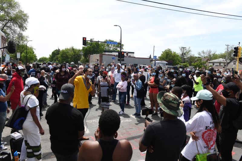 Foundations Church minister, Jordan Borer Nelson, addresses a small crowd at the site where African-American man George Floyd was fatally injured by police in Minneapolis