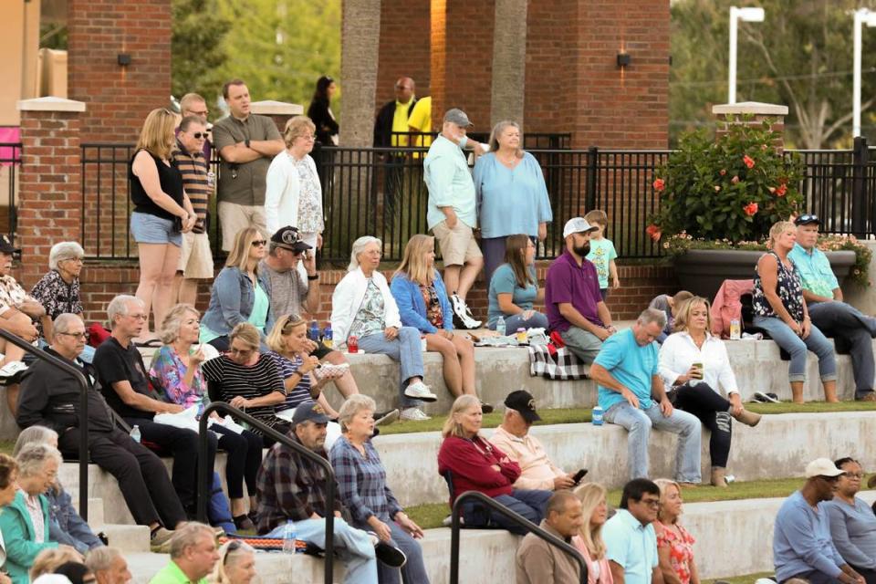 People gather at the Icehouse Amphitheater for a night of music in Lexington.