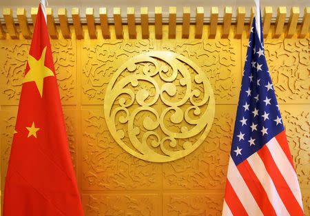 FILE PHOTO: Chinese and U.S. flags are set up for a meeting during a visit by U.S. Secretary of Transportation Elaine Chao at China's Ministry of Transport in Beijing, China April 27, 2018. REUTERS/Jason Lee