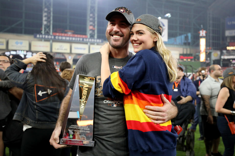 <p>Justin Verlander #35 of the Houston Astros celebrates with model Kate Upton and the MVP trophy after defeating the New York Yankees by a score of 4-0 to win Game Seven of the American League Championship Series at Minute Maid Park on October 21, 2017 in Houston, Texas. The Houston Astros advance to face the Los Angeles Dodgers in the World Series. (Photo by Ronald Martinez/Getty Images) </p>