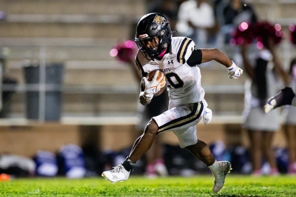 Buchholz Bobcats running back Quinton Cutler (10) rushes with the ball for a touchdown during the first half against the Gainesville Hurricanes at Citizens Field in Gainesville, FL on Thursday, October 5, 2023. [Matt Pendleton/Gainesville Sun]