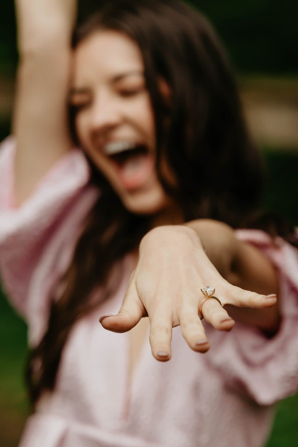 Brooke's wedding ring is a custom 18k yellow gold set with a 3.5 carat elongated cushion cut by Brilliant Earth