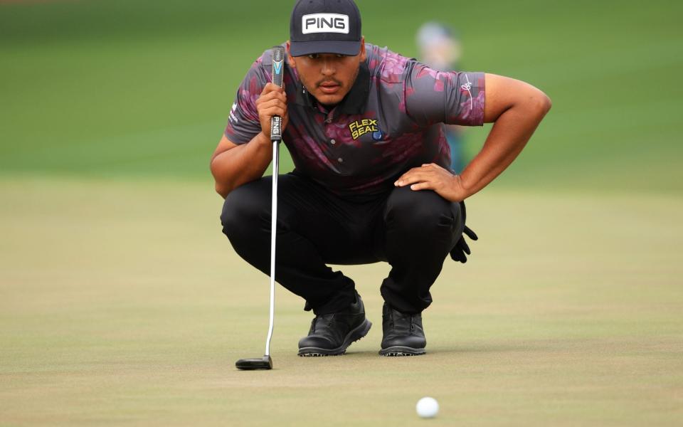 Sebastian Munoz of Colombia lines up a putt on the second green during the third round of the Masters at Augusta National Golf Club - Getty Images