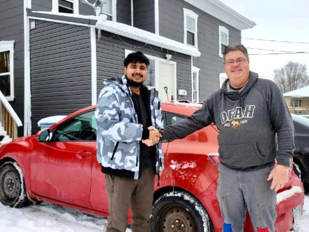 After Sandip Adhikari and his three roommates bought this 2011 Mazda 3 from Chris Delgary of Mount Brydges, Ont., he decided to help the four students from Nepal after realizing they had been living in an unfurnished apartment.  (Submitted by Chris Delargy - image credit)