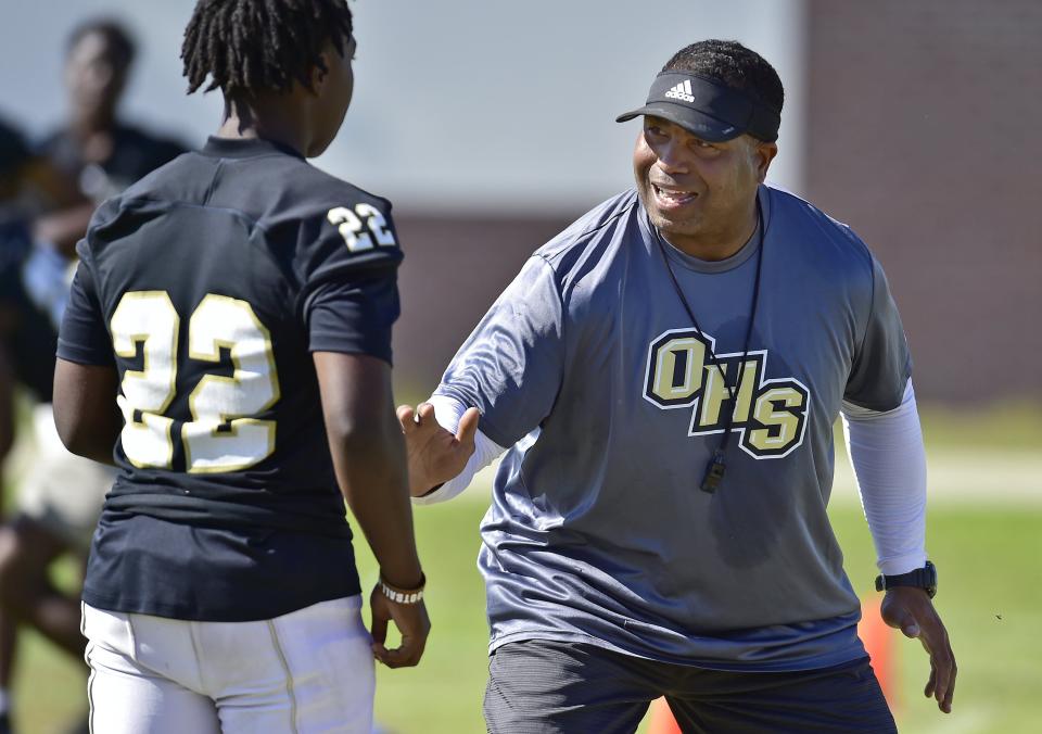 Oakleaf head coach Christopher Foy issues instructions during a spring practice session.