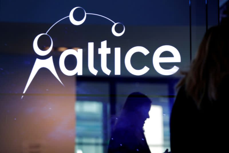 FILE PHOTO: The logo of cable and mobile telecoms company Altice Group is seen during a news conference in Paris