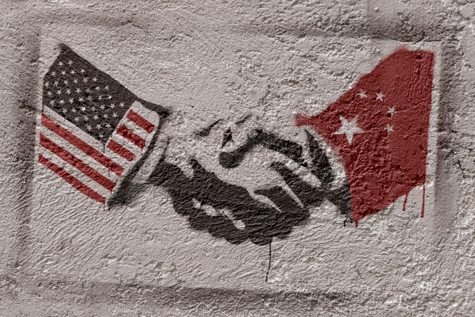 Stencil graffiti representing the agreement of two countries (USA - CHINA). Photographer's own design.