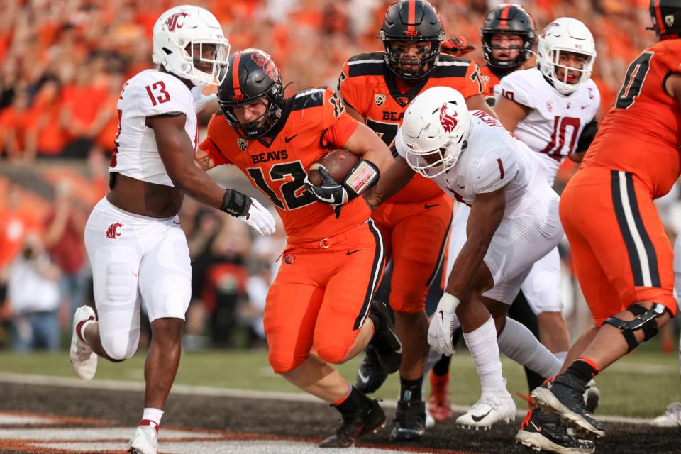 Oregon State inside linebacker Jack Colletto (12) bowls in for the touchdown during the first quarter against Washington State at Reser Stadium at Oregon State University in Corvallis, Ore. on Saturday, Oct. 15, 2022.