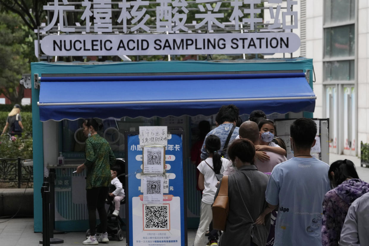 Residents line up for mass COVID tests, Monday, June 13, 2022, in Beijing. (AP Photo/Ng Han Guan)