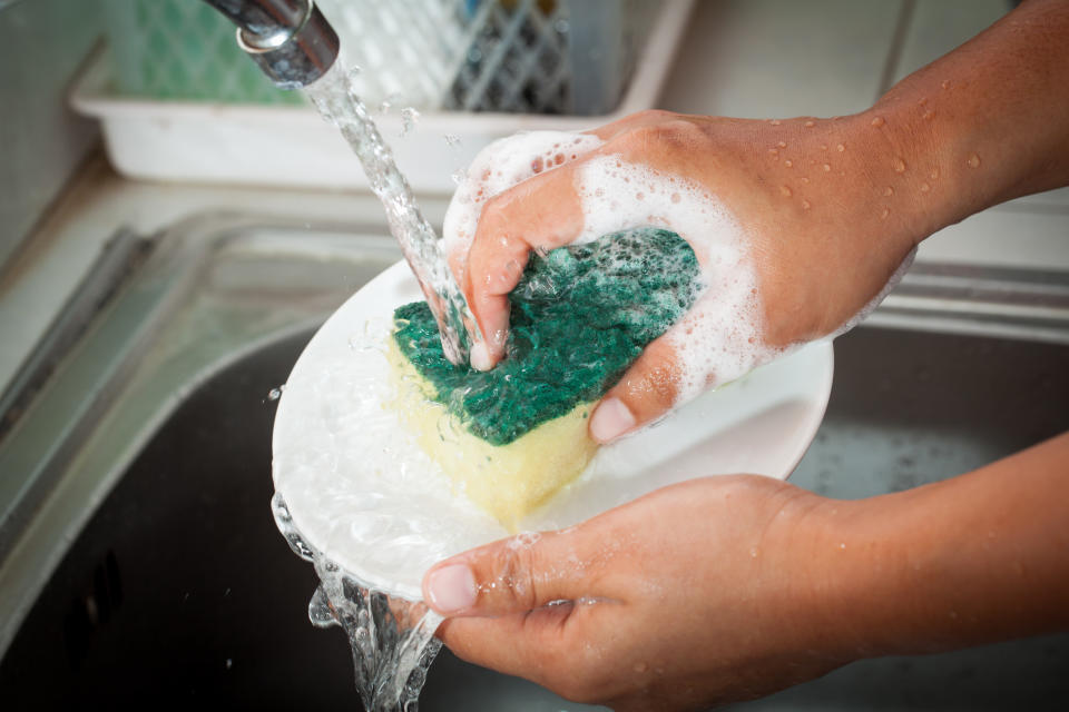 A man washing dishes