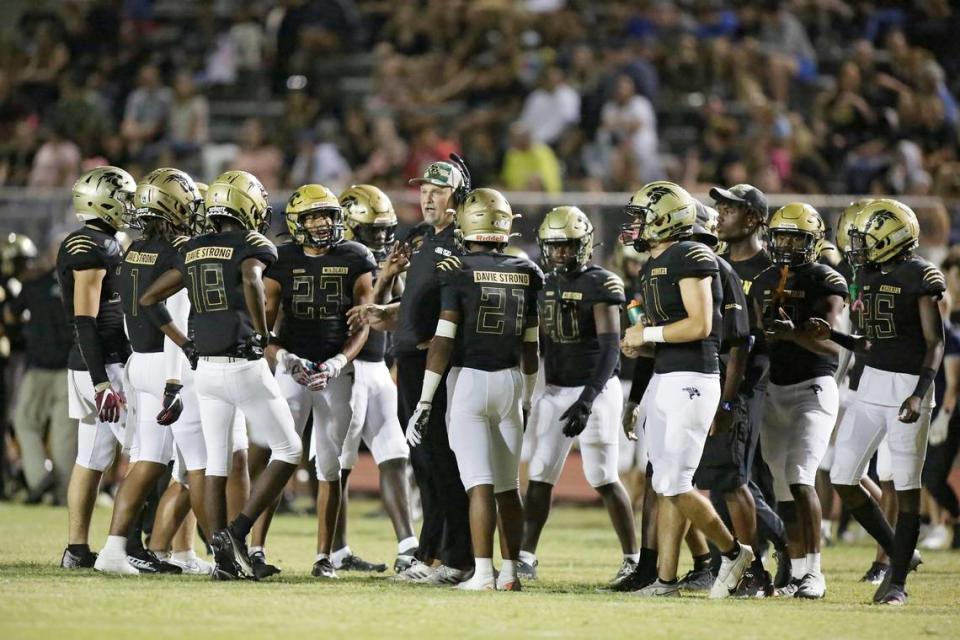 Western Wildcats take a time out during football game against Plantation Colonels on Friday, November 4, 2022 at Western HS in Davie. Andrew Uloza / for Miami Herald