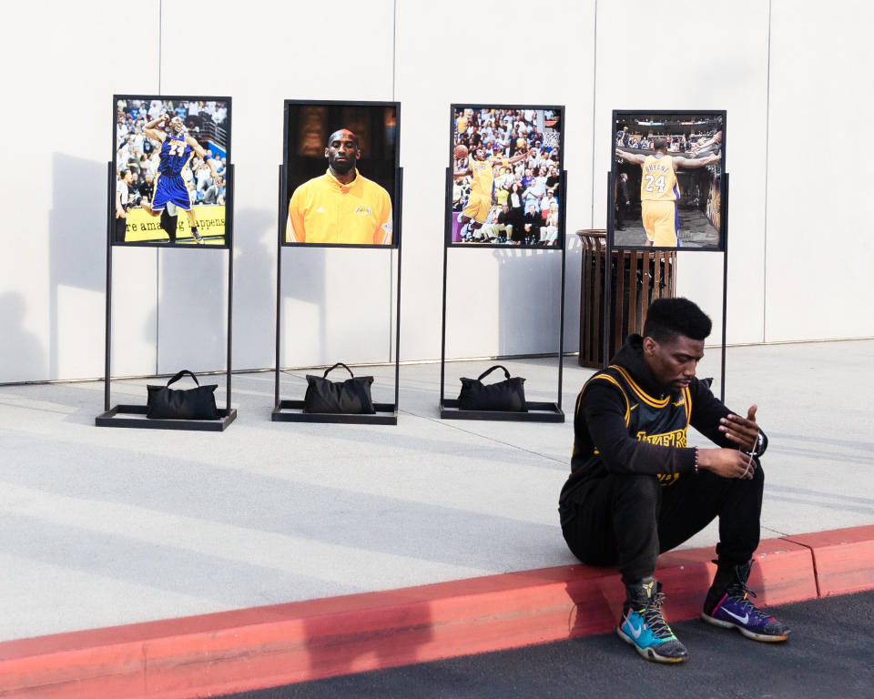 A fan sits outside of the Los Angeles Lakers training facility in El Segundo, California. (Photo: Joseph Gray)