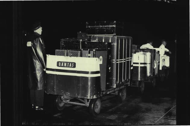 Luggage for the King of Thailand's royal tour of Australia arrived by Qantas plane from New Zealand tonight.Here security police guard the trolley loads of luggage. August 25, 1962.