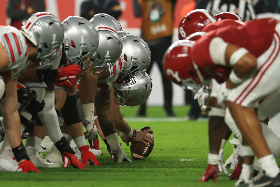 Alabama and Ohio State players line up before a snap during the College Football Playoff title game on Jan. 11. (Mike Ehrmann/Getty Images)