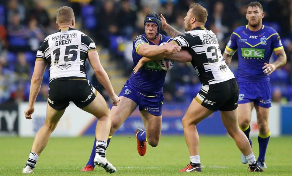 Warrington’s Chris Hill is tackled by Hull’s Joe Westerman