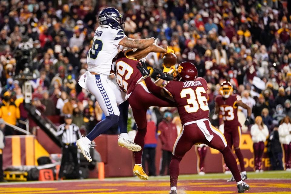 Washington cornerback Kendall Fuller (29) intercepts a pass in the end zone intended for Seattle Seahawks wide receiver Freddie Swain (Julio Cortez/AP) (AP)