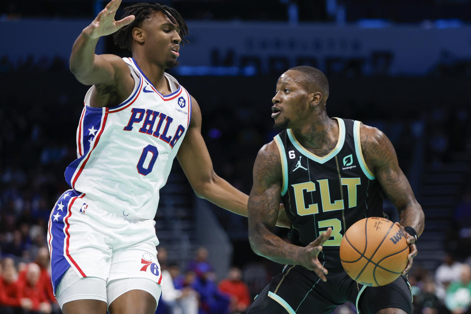 Charlotte Hornets guard Terry Rozier (3) looks to drive against Philadelphia 76ers guard Tyrese Maxey (0) during the first half of an NBA basketball game in Charlotte, N.C., Friday, March 17, 2023. (AP Photo/Nell Redmond)