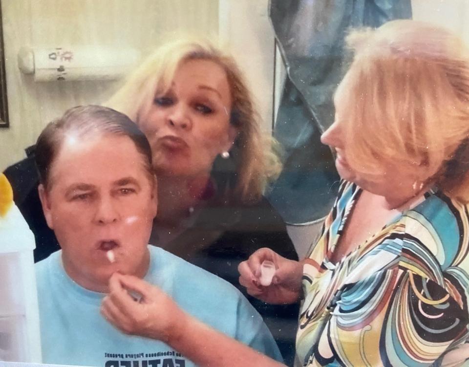 Jodie Jarvis (center) and Carol Bryant prepare Jim Jarvis' makeup for his role in The Schoolhouse Players Father Knows Best.