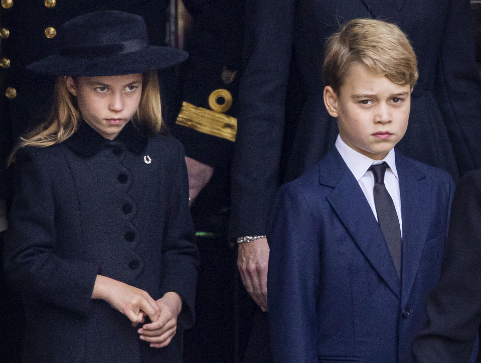 LONDON, ENGLAND - SEPTEMBER 19:  L-R Princess Charlotte of Wales and Prince George of Wales during the State Funeral of Queen Elizabeth II at Westminster Abbey on September 19, 2022 in London, England. Queen Elizabeth II died at Balmoral Castle in Scotland on September 8, 2022, and is succeeded by her eldest son, King Charles III. (Photo by Patrick van Katwijk/Getty Images)