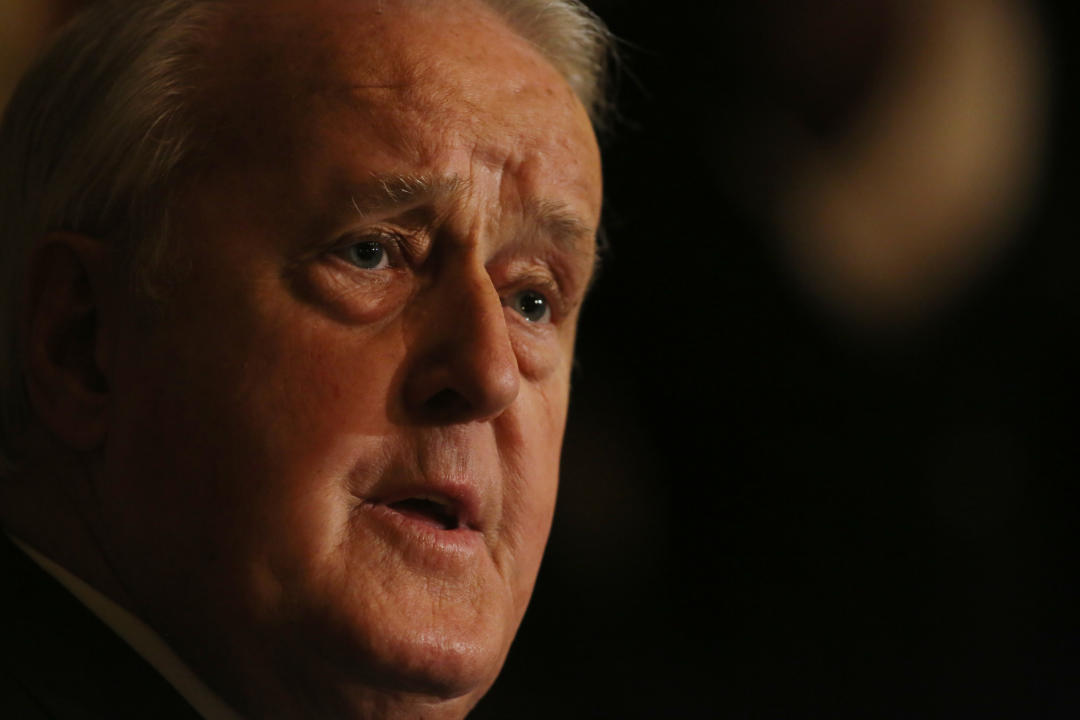 Canada's former prime minister Brian Mulroney speaks with the media before receiving the Commander of the National Order of Legion of Honour at the French Embassy in Ottawa on December 6, 2016. - Mulroney will be the first head of Canadian government to receive the distinction. The Legion of Honour is the highest decoration that France can bestow. (Photo by Lars Hagberg / AFP) (Photo by LARS HAGBERG/AFP via Getty Images)