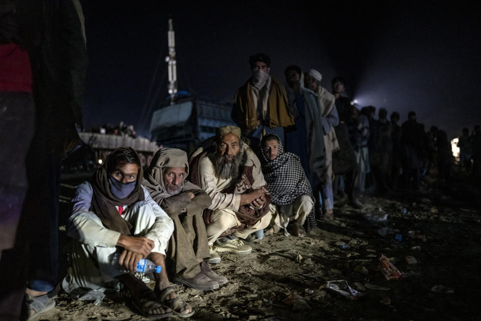 Afghan refugees line up to register in a camp near the Torkham Pakistan-Afghanistan border, in Torkham, Afghanistan, Friday, Nov. 3, 2023. A huge numbersof Afghan refugees entered the Torkham border to return home hours before the expiration of a Pakistani government deadline for those who are in the country illegally to leave or face deportation. (AP Photo/Ebrahim Noroozi)