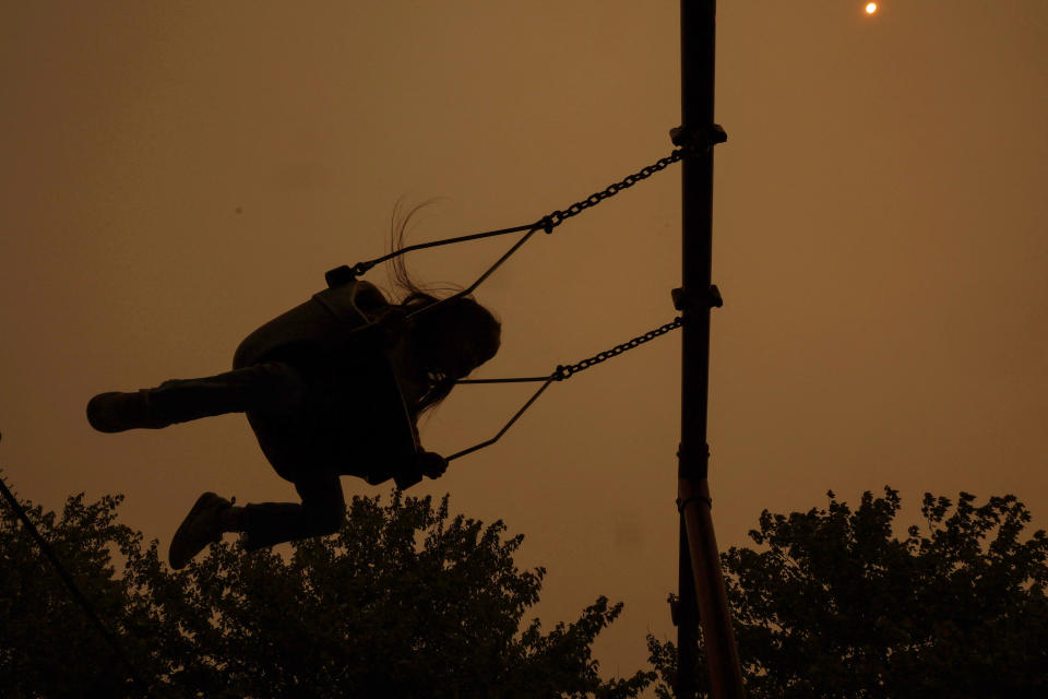 <p>A girl on a swing is seen in silhouette as haze and smoke from the Canadian wildfires shroud the sky at Barretto Point Park in the Bronx borough of New York City, U.S., June 7, 2023. REUTERS/Shannon Stapleton</p> 
